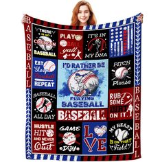 a woman holding up a baseball blanket