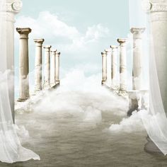 an artistic photo with columns and clouds in the sky behind them, as if it were created from photoshopped