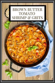 brown butter tomato shrimp and grits recipe in a skillet on a wooden table