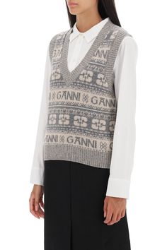 Ganni vest crafted in solid recycled wool blend knit with jacquard logo motif all-over. It features V neck and ribbed trims. Regular fit. The model is 177 cm tall and wears size XS. Composition: 45% WO, 35% WO-R, 20% PA-RComposition: 45% Wool, 35% Rec Wool, 20% Rec Polyamide | Ganni Women's Jacquard Logo Motif Vest in Grey | FW23/24 Ganni Vest, Vintage Inspired Earrings, Fall Vest, Mohair Sweater, Vest Outfits, Luxury Retail, Vest Jacket, Gender Female, Wool Blend