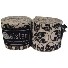 two rolls of fabric with skulls on them, one is white and the other is black