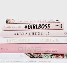 a stack of books with the words girlboss written on them in different languages