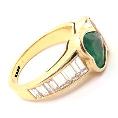 Authentic Van Cleef & Arpels 18k Gold Diamond Emerald Yellow Sapphire Ring Paper  Metal: 18k yellow gold  Measurements:  Size: 6  Width at Top: 9mm  Weight 7.3 grams  Stones: 7 emerald cut diamonds, VVS1 Clarity, G Color. Total Diamond Weight approx. .50ct. 1 Heart Shape Emerald Stone total weight 1.5ct 1 Heart Shape Yellow Sapphire Stone total weight 1.5ct  Hallmarks: VCA 750 B54XXXX 10 (serial number omitted)  Dimensions reference the ring size and are not specific to the ring itself. Anniversary Yellow Gold Multi-stone Emerald Ring, Yellow Gold Emerald Cut Multi-stone Ring, Classic Multi-stone Yellow Gold Emerald Ring, Yellow Gold Multi-stone Baguette Cut Rings, Ring Paper, Yellow Sapphire Ring, Yellow Sapphire Rings, Authentic Vans, Emerald Stone