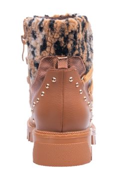 Fluffy faux shearling brings cozy style to a side-zip bootie constructed with lace-up front ties, gleaming stud trim and a grippy lugged sole. 1 1/2" heel 5 1/2" shaft Cushioned footbed Synthetic and synthetic faux-shearling upper/synthetic lining and sole Imported Winter Lace-up Combat Boots With Zipper Closure, Winter Synthetic Boots With Zipper Closure, Winter Synthetic Boots With Zipper, Fall High-top Boots With Faux Fur Lining, Fall Boots With Faux Fur Lining, Brown Winter Combat Boots With Zipper Closure, Winter Lace-up Ankle Boots With Zipper, Synthetic Boots With Faux Fur Trim For Fall, Fall Boots With Faux Fur Trim And Synthetic Material