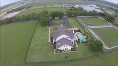 an aerial view of a large house in the country