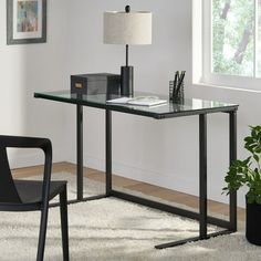 The modern, stylish Christopher Knight Home Eghan computer desk is a must have for any home office. The tempered glass top provides you with a clean working surface, while providing ample space for all of your office needs. Includes: One (1) computer desk Materials: Tempered glass, iron Color: Transparent Finish: Black Assembly required: Yes Weight: 56-pounds Dimensions: 29.50 inches high x 47.25 inches wide x 23.75 inches deep Furniture Room: Bedroom, Living Room, Office Material: Iron, Glass S Glass Computer Desk, Glass Desk Office Decor, Home Office Glass Desk, Glass Desk Ideas, Desk In Front Of Window, Black Glass Desk, Gaming Desk White, Teachers Lounge Makeover, Glass Office Desk