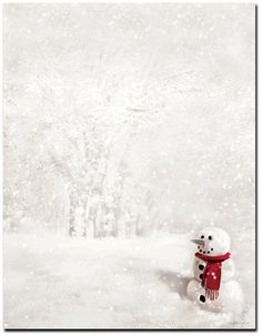 a snowman with a red scarf and hat on in the middle of a snowy field