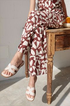 geometric design | brown and white | jumpsuit | romper | slide sandal Unique Fits, White Jumpsuit, Rich Textures, Shoes And Accessories, Flat Sandals, Slide Sandals, Embossed Leather