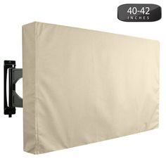 the back side of a wall mounted tv with a beige cover on it's sides