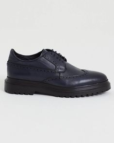 Crafted for the modern man, these classic brogues combine timeless elegance with contemporary design. Perfect for formal occasions or adding a sophisticated touch to your everyday wear. Luxury Blue Leather Shoes For Business Casual, Classic Blue Plain Toe Oxfords, Elegant Wingtip Derby With Textured Sole, Elegant Blue Semi-formal Oxfords, Classic Navy Oxfords With Plain Toe, Blue Wingtip Dress Shoes With Brogue Detailing, Classic Blue Oxfords With Brogue Detailing, Classic Blue Oxfords For Formal Occasions, Blue Wingtip Leather Shoes For Work