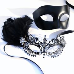 Couples masquerade masks, black feather, women metal mask and Venetian men mask Women black mask studded with black onyx rhinestones that give a hint of metallic shade. This mask has black with feathers with black/gold crystal brooch. Men's mask is a simple black base with a comfortable fit. S H I P P I N G - Processed same day or within 24 hours. 1-2 day guaranteed delivery services offered, add items to cart and click on shipping tab for rates. Please leave a check out note with your need date Black Masks For Halloween Gift, Black Halloween Masks As Gifts, Black Masquerade Mask For Halloween Gift, Black Masks And Prosthetics For Mardi Gras Masquerade, Black Masks For Mardi Gras Masquerade, Elegant Black Masks And Prosthetics For Theater, Black Eye Mask For Masquerade, Black Fantasy Eye Mask, Fantasy Style Black Eye Mask