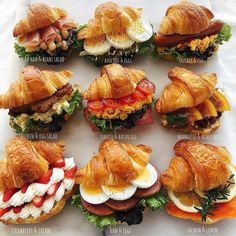 a bunch of croissant sandwiches with meat and cheese on them, all lined up