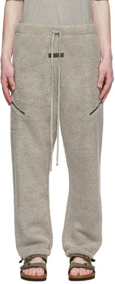 Sherpa fleece lounge pants. · Drawstring at elasticized waistband · Rubberized logo patch at front · Gusset at dropped inseam · Zip pockets · Two-pocket styling · Bungee-style drawstring at elasticized cuffs · Fully polyester mesh lining Please note that this item may not be shipped within the EU. Supplier color: Dark oatmeal Gray Fleece Sweatpants For Streetwear, Fleece Moisture-wicking Sweatpants For Loungewear, Moisture-wicking Fleece Sweatpants For Loungewear, Mens Fleece Pj Pants, Moisture-wicking Fleece Sweatpants For Streetwear, Grey Lounge, Pants Outfit Men, Fleece Pants, Mens Fleece