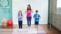 a woman and two children are doing yoga