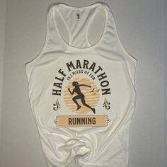 a white tank top that says half marathon running