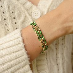 I added a pop of colour to my Classic gold bead bracelet and it is the perfect addition to a dainty stack. The beads are strung on a premium stretch cord. You will love this Green Shades MixSOLD BY ONE BRACELET or Set of fourITEMS DETAILS:Water Resistant -Nickel-free - Allergy-free- 18K gold plated brass beads made to last- round bead size: 2mm- Glass seed beads 2mm- stretchy elastic cord, no clasp, designed to fit wrist sizes from 6 - 7 inches Trendy Hand-strung Gold Friendship Bracelets, Trendy Gold Hand-strung Friendship Bracelets, Trendy Gold Stretch Bracelet With Faceted Beads, Gold Bead Bracelet, Rainbow Loom Bands, Miyuki Bracelet, Green Shades, 40th Gifts, Brass Beads