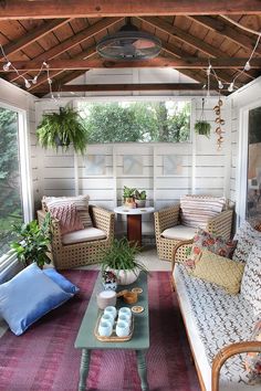 an instagram photo of a living room with couches and pillows