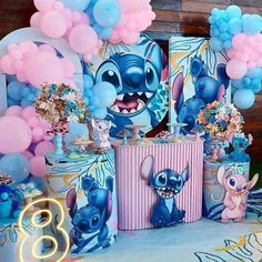 an image of a birthday party set up with balloons and decorations in the shape of stitch