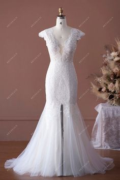 Cap Sleeve Scallop Lace Neck Chic Slit Fit and Flare Wedding Dress #weddingdress #bridaldress #designerweddingdress #springweddingdress #fallweddingdress #autumnweddingdress #destinationbridaldress #elegantweddingdress Flare Wedding Dress, Chic Wedding Dresses, Spring Wedding Dress, Lace Neck, Scalloped Neckline, Fit And Flare Wedding Dress, Fit And Flare Skirt, Designer Bridal Gowns, Custom Wedding Dress