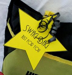 a bag with a yellow star on it and a sign that says swaggle you must go