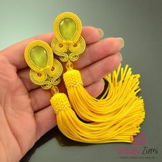 Colorful party earrings, yellow tassel earrings, long yellow earrings, deep yellow earrings, yellow earrings for bride, earrings for gift  FAST SHIPPING - order is delivered to you by COURIER  SHIPMENT  (phone number required)! I created these ethnic, yellow Soutache earrings with tassels, which I called 'YELLOW TASSEL ORKID' without a pattern - this makes it OOAK. They were made for women who like nature, boho-chic and appreciate unusual and clear combination of gems and the set of yellow Soutache cords.  These extravagant earrings would also make an EXCELLENT GIFT FOR HER: Valentine's, Birtday, Christmas, Symphaty or Wedding, etc. OTHER TASSEL EARRINGS IN MY STORE: https://www.etsy.com/shop/OzdobyZiemi?ref=l2-shopheader-name§ion_id=19894239 ITEM DETAILS: *MATERIALS: glass crystal in the Handmade Yellow Earrings For Party, Yellow Dangle Tassel Earrings For Party, Yellow Tassel Drop Earrings For Party, Yellow Latkans Earrings For Party, Yellow Party Earrings With Latkans, Elegant Yellow Dangle Tassel Earrings, Elegant Yellow Tassel Earrings For Gift, Yellow Latkan Earrings For Party, Elegant Yellow Tassel Earrings