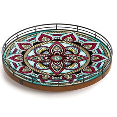 a decorative glass tray with an intricate design