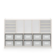 a white shelf with many drawers and bins