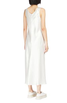 Lustrous, textured satin elevates the elegance of this midi-length dress featuring a scoop neckline and a sleeveless silhouette. Slips on over head Scoop neck Sleeveless 100% acetate Dry clean Imported Elegant Silk Sleeveless Wedding Dress, Elegant Sleeveless Slip Dress For Daywear, White Sleeveless Silk Satin Dress, White Satin Sleeveless Silk Dress, Sleeveless Bias Cut Midi Dress For Wedding, Elegant Silk Satin Dress For Daywear, Sleeveless Satin Midi Dress For Daywear, White Sleeveless Silk Dress For Formal Occasions, Elegant White Silk Sleeveless Dress