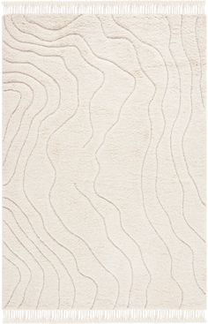 a white rug with wavy lines on it