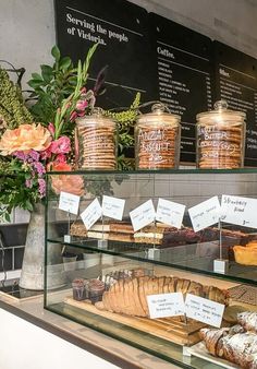 a display case filled with lots of different types of bread