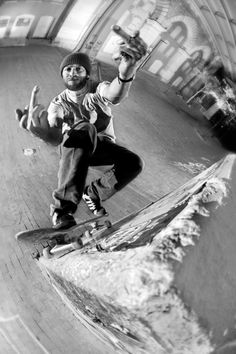 a man riding a skateboard up the side of a ramp