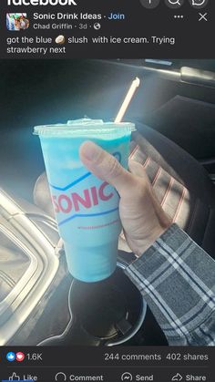 someone holding up a plastic cup in their hand with the word sonic printed on it