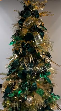 a christmas tree with green and gold decorations