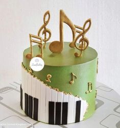 a cake decorated with musical notes and piano keys