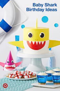 a baby shark birthday party with cupcakes and cake