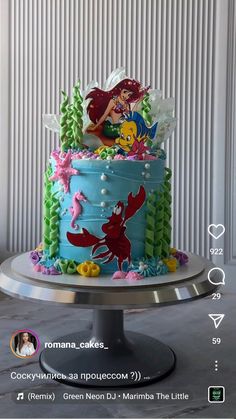 the little mermaid cake has been decorated with fondant and icing, as well as other decorations