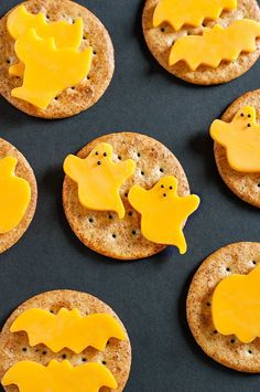 some crackers with cheese on them and the words, awesomely cheesy halloween recipes