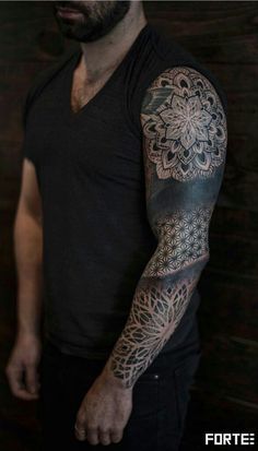 a man with a tattoo on his arm