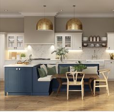 a kitchen filled with lots of counter top space and wooden flooring next to a dining table