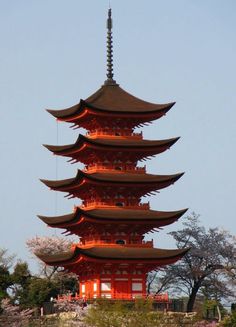 a tall tower with lights on top of it