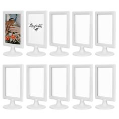 a set of nine white pedestal mirrors with pictures on each one side and the other half