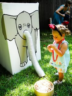 Feed the Elephant: This was a big hit with the little kids. (Charlie painted this on a washing machine box and used a dryer vent for the trunk.)  The kids would place peanuts in the trunk to "feed the elephant" and raise the trunk until the peanuts dropped inside. Circus Party Games, Circus Party Ideas, Elephant Birthday Party, Carnival Parties, Harvest Fest