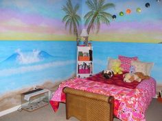 a bedroom decorated in pink, orange and blue with a palm tree painted on the wall