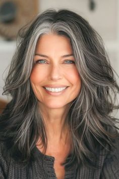 Smoky Charcoal Highlighted Layers hair color on a smiling woman with dark brown hair with gray blending. Salt And Pepper Hair, Natural Gray Hair, Blending Gray Hair, Gray Hair Highlights, Long Gray Hair, Grey Hair Color