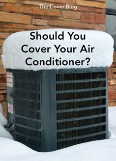 an air conditioner covered in snow with the words should you cover your air conditioner?