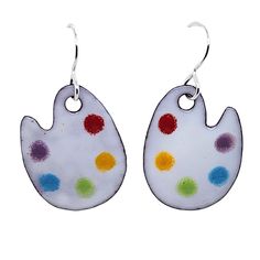 These artist palette earrings are fun and colorful, and they will brighten up your day! They are made out of glass enamel fused in a kiln to a copper base.  The ear wires at the top are solid sterling silver. The rainbow of colors on the paint palettes make them easy to match to many outfits, and the bright white base helps them stand out no matter what you hair color is :) They make a great gift for artists and painters, as well as art and elementary school teachers.  Really they can be worn by Artistic Enamel Earrings Nickel-free, Hand Painted Artsy Enamel Earrings, Artistic Enamel Earrings, Hand Painted Enamel Artsy Earrings, Artistic Colorful Earrings, Artsy Enamel Earrings As Gift, Paint Palettes, Ceramic Earrings, Artist Palette