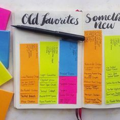 an open notebook with colorful sticky notes and a black pen on the page that says old favorites something new