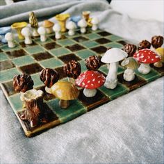 a close up of a chess board with mushrooms on it