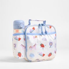 A fun and functional lunch box that's built to handle all the thrills and spills of the day. Sweet rainbow hearts, frolicking unicorns, flowers and strawberries decorate the lunch box's exterior, and a soft blue trim gives it the perfect finish. It's constructed of food-safe and supremely durable polyester fabric that includes recycled plastic bottles. It's also lightweight and easy to clean, plus roomy enough to hold multiple storage containers. An insulated lining keeps meals just the way your Food Container Storage, Rainbows And Unicorns, Kids Pencil Case, Unicorn Backpack, Container Storage, Backpack Gift, Rainbow Hearts, Kids Gear, Kids Lunchbox