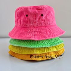 Fun and stylish Washed Bright Neon Bucket Hat that makes the perfect accessory. 100% breathable cotton Super comfy Brass Eyelets for ventilation Can be folded and packed for easy travel Circumference: 22-22.8 inches (56-58cm) To view the rest of our collection, please visit: brightideasnyc.com Bucket Hat Beach, Fashion Bucket Hat, Bucket Hat Fashion, Easy Travel, Beach Hat, Bucket Hats, Colorful Fashion, Sun Hats, Hat Fashion